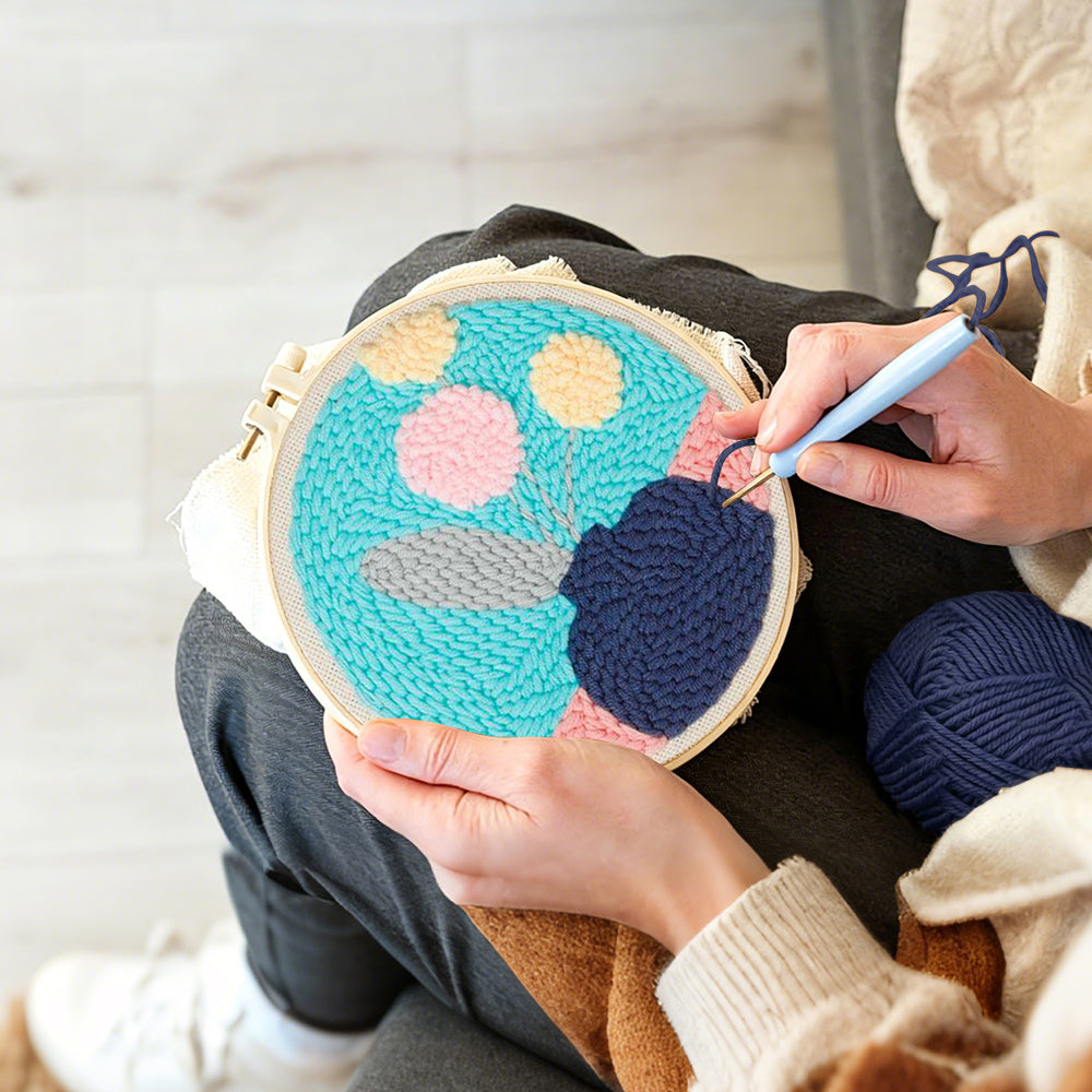 Creating handmade blue vase with pastel flowers punch needle artwork