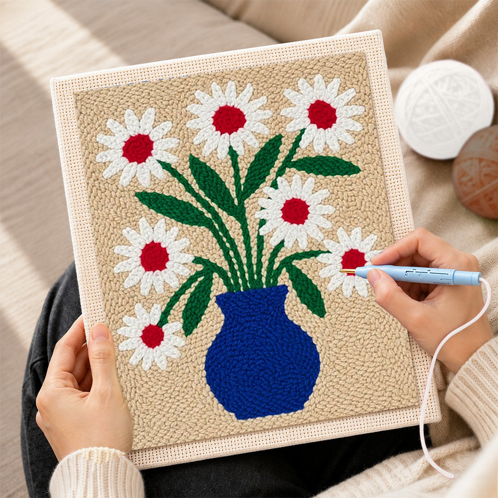 Creating handmade blue vase with red-centred daisies punch needle artwork