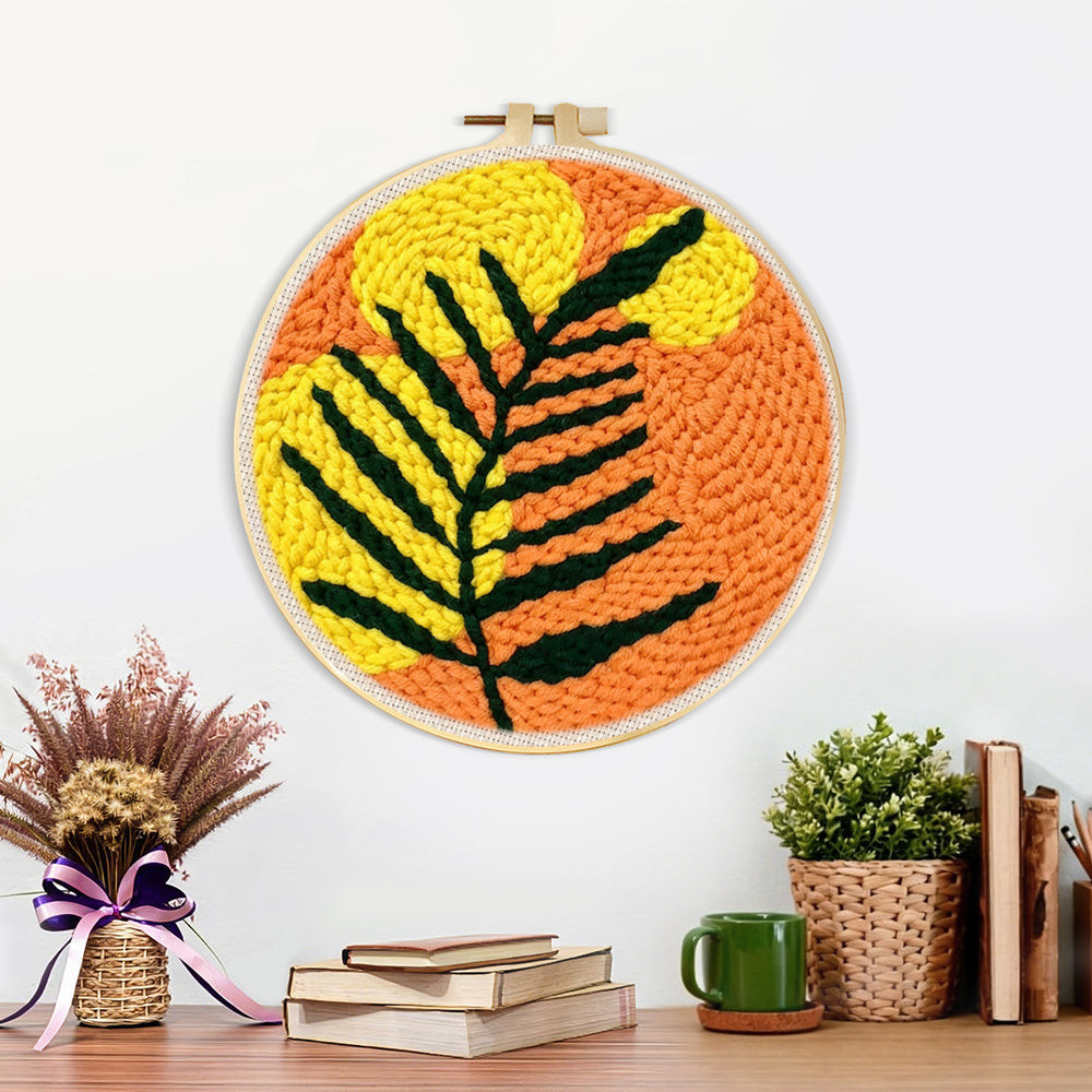 Finished bold black and yellow leaf artwork displayed on a wall