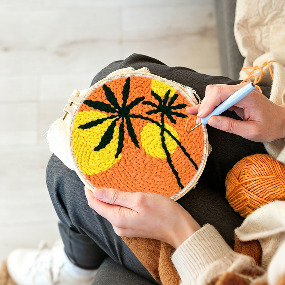 Creating handmade bold sunset palm silhouette punch needle artwork