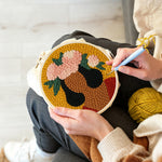 Creating handmade bold woman with pink floral crown punch needle artwork