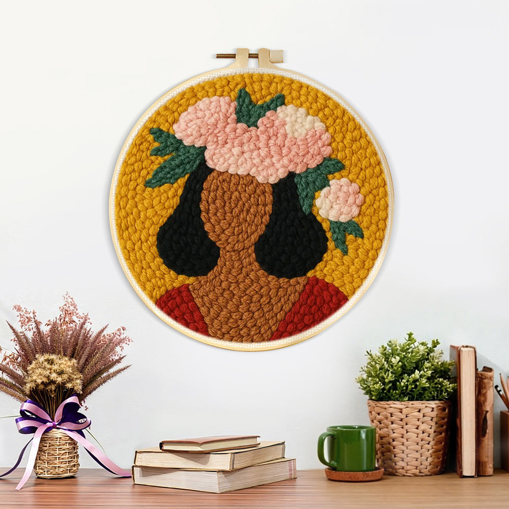 Finished bold woman with pink floral crown artwork displayed on a wall