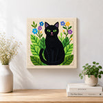 Finished botanical black cat artwork displayed on a wall