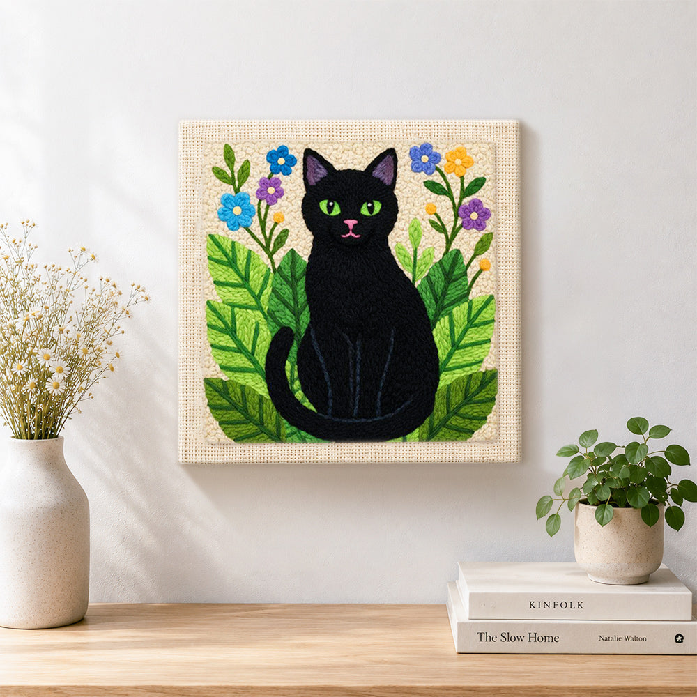 Finished botanical black cat artwork displayed on a wall
