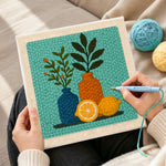 Creating handmade botanical still life punch needle artwork