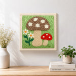 Finished brown and red mushrooms artwork displayed on a wall