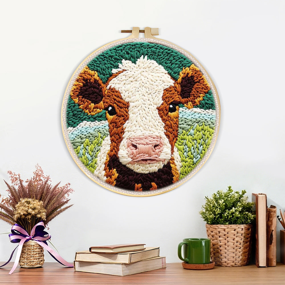 Finished brown and white cow face artwork displayed on a wall