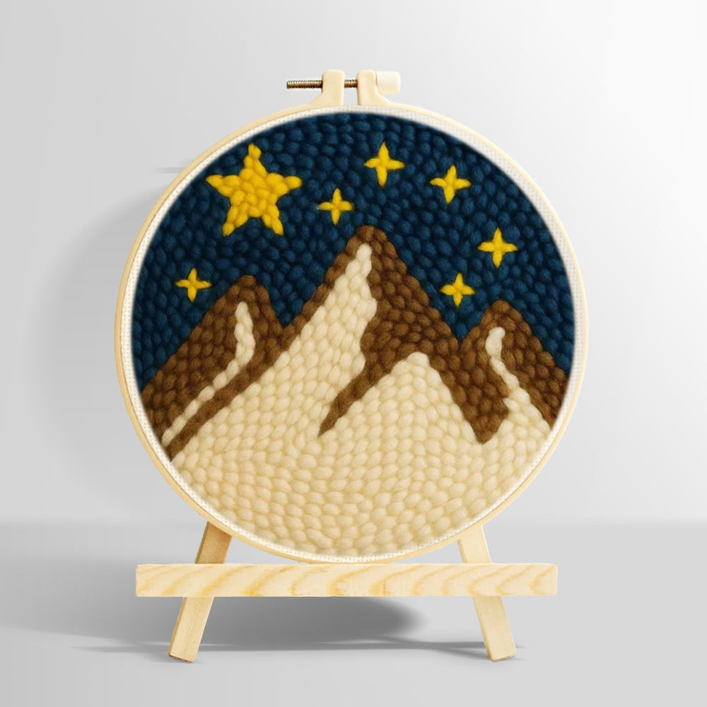 Brown and white snowy mountains under a starry sky punch needle kit for beginners