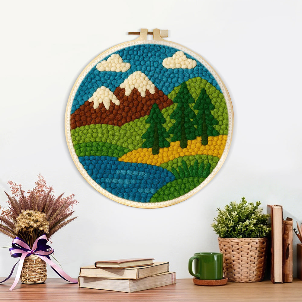 Finished brown mountains and pine trees by the river artwork displayed on a wall