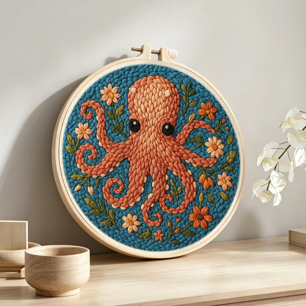 Brown octopus and flowers punch needle artwork displayed on a table