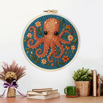 Finished brown octopus and flowers artwork displayed on a wall