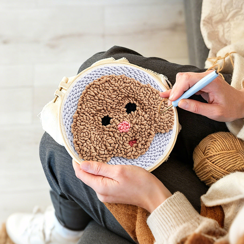 Creating handmade brown puppy punch needle artwork