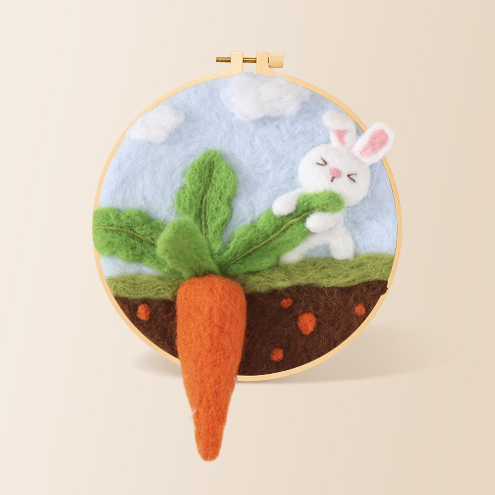Bunny pulling a giant carrot needle felting kit for beginners with a round wooden frame