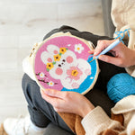Creating handmade bunny with flowers punch needle artwork
