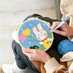 Creating handmade bunny with heart-shaped balloons punch needle artwork