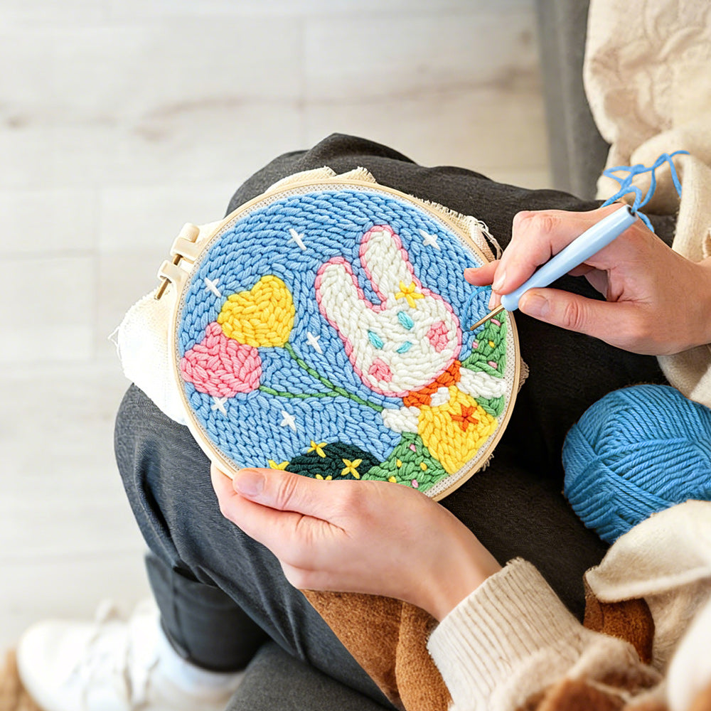 Creating handmade bunny with heart-shaped balloons punch needle artwork