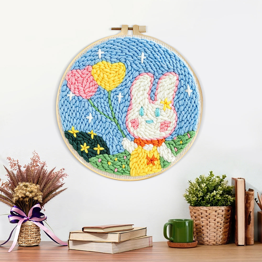 Finished bunny with heart-shaped balloons artwork displayed on a wall