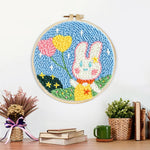 Finished bunny with heart-shaped balloons artwork displayed on a wall