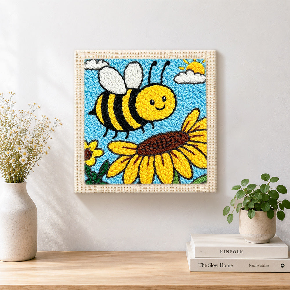 Finished buzzing bee with giant sunflower artwork displayed on a wall
