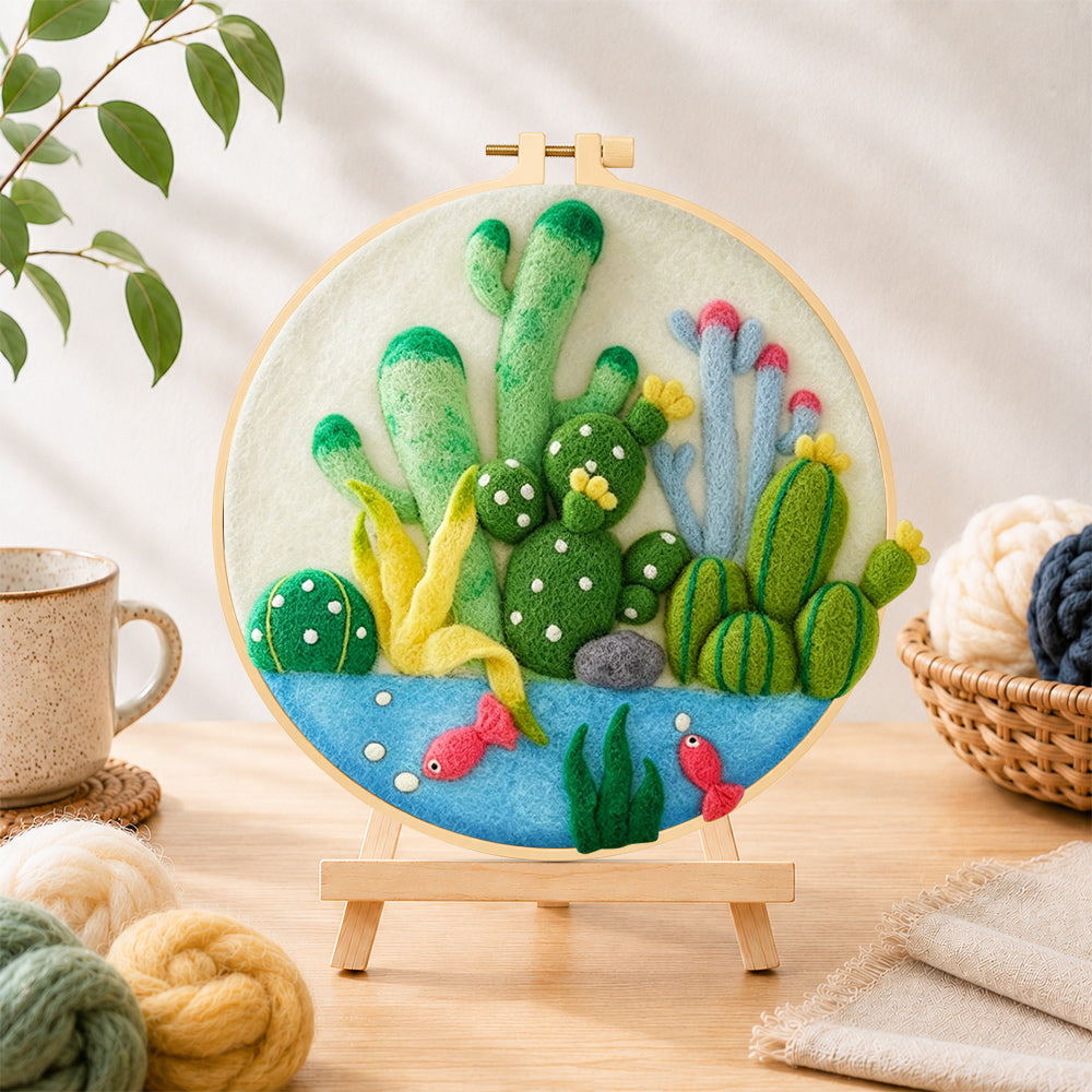 Finished cactus garden with fish needle felting displayed on a wooden easel
