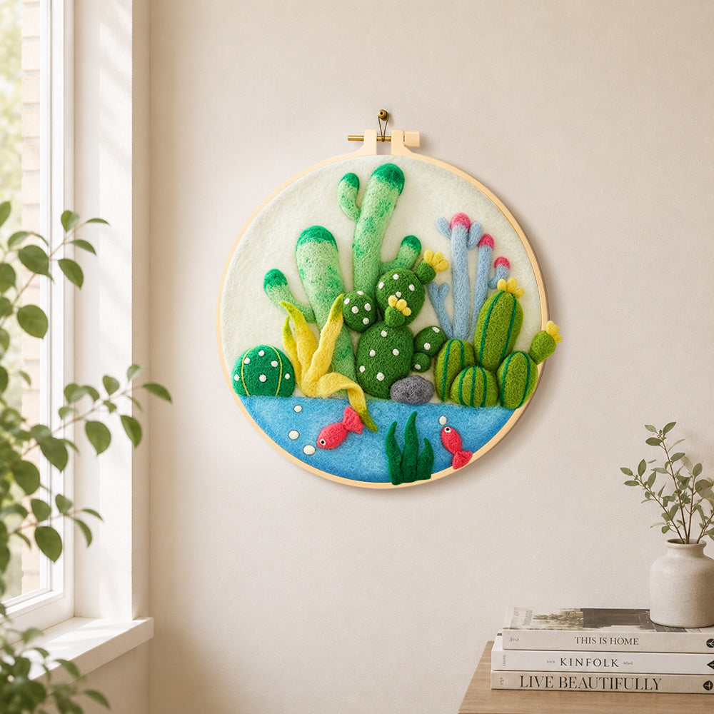 Cactus garden with fish needle felt wall art displayed in a bright home interior