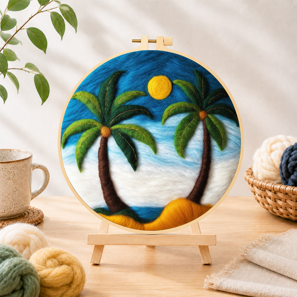 Finished calming blue sky palm trees needle felting displayed on a wooden easel
