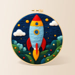 Cartoon rocket launch needle felting kit for beginners with a round wooden frame