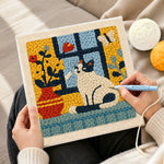 Creating handmade cat and flower vase on windowsill punch needle artwork