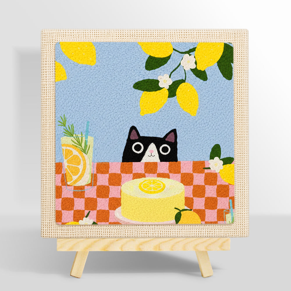 Cat peeking at lemon cake punch needle kit for beginners