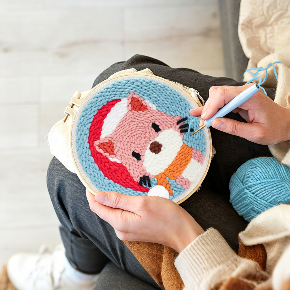 Creating handmade cat wearing a santa hat punch needle artwork