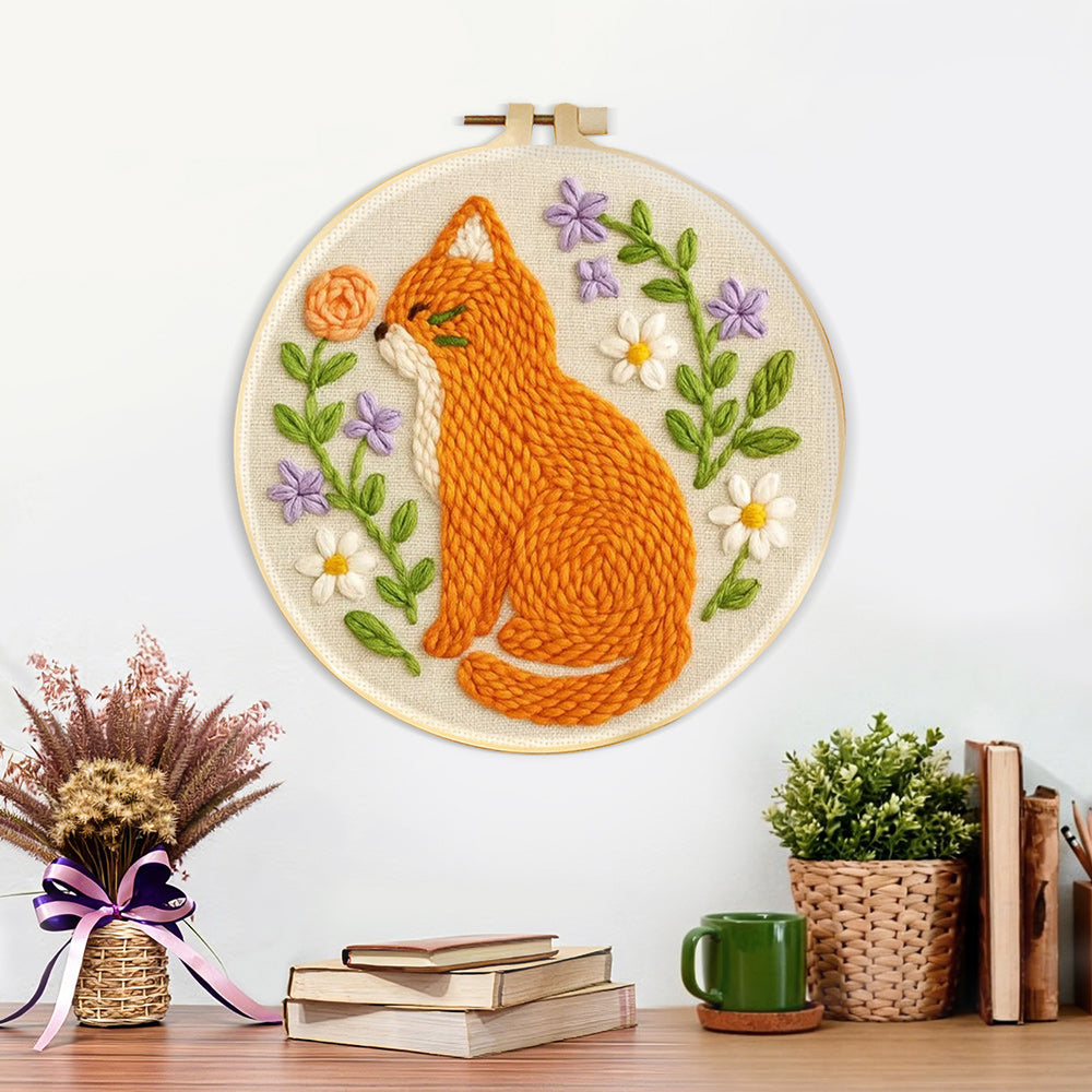 Finished cat with wildflowers artwork displayed on a wall