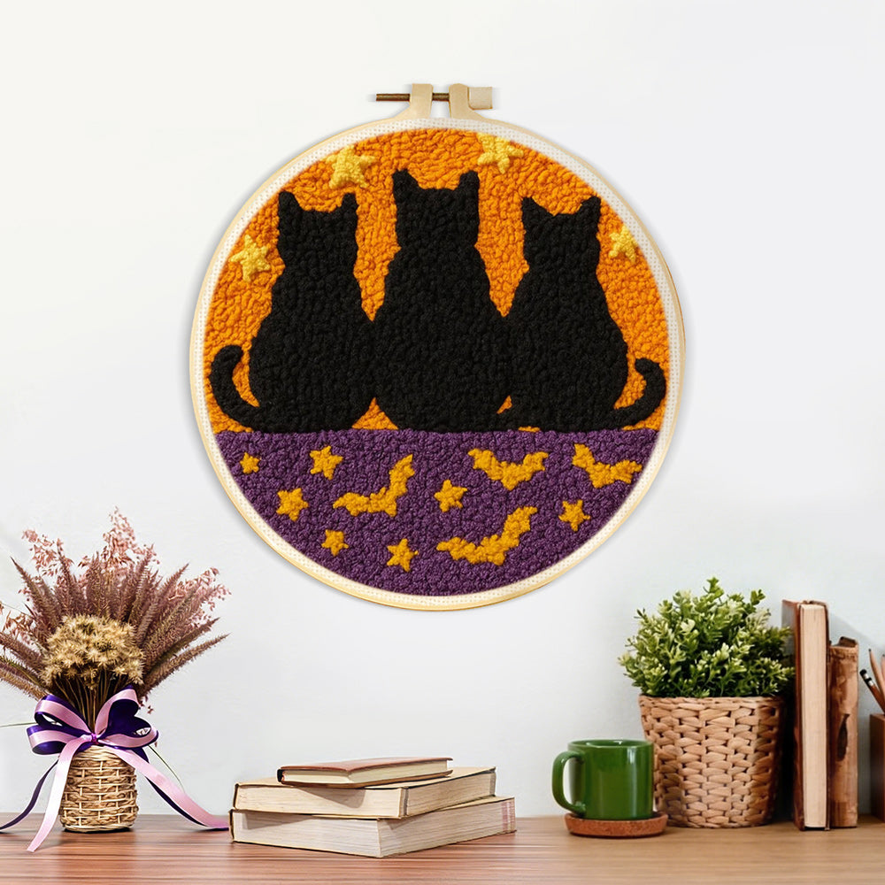 Finished cats and bats artwork displayed on a wall