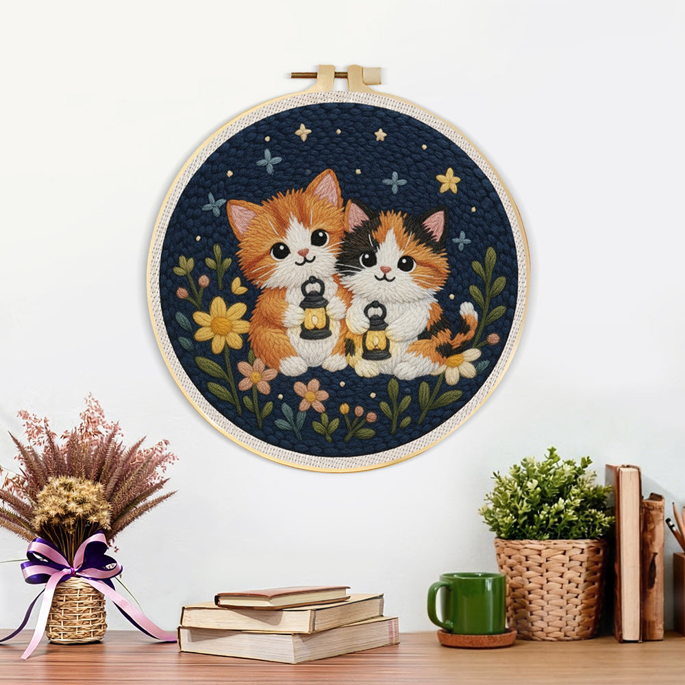 Finished cats and wildflowers under the night sky artwork displayed on a wall