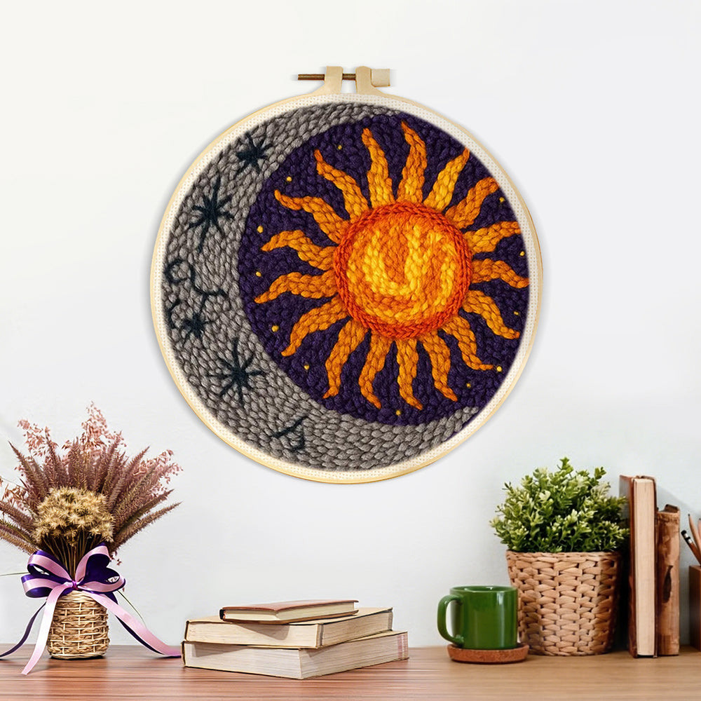 Finished celestial sunburst and crescent moon artwork displayed on a wall