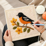 Creating handmade charming bird on a flower branch punch needle artwork