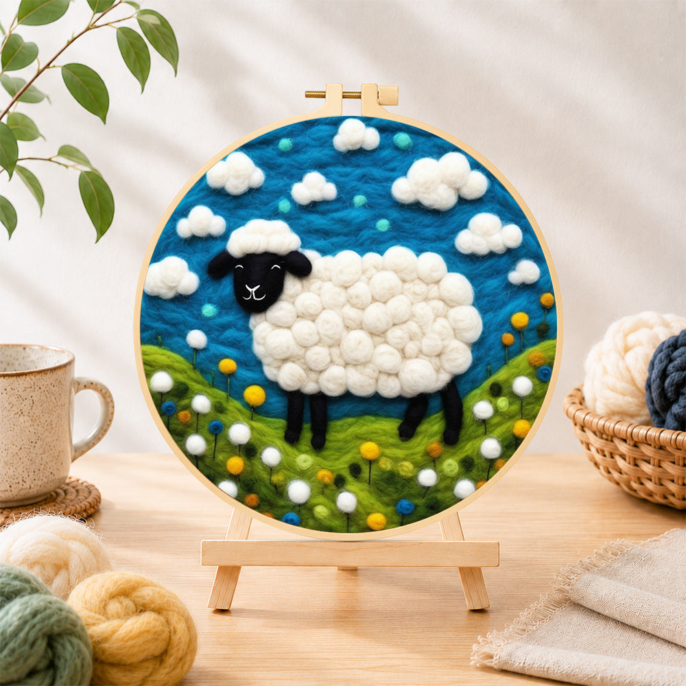 Finished charming black-faced sheep in sunny meadow needle felting displayed on a wooden easel