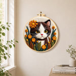 Charming brown and white cat with flowers needle felt wall art displayed in a bright home interior