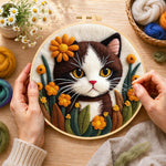 Creating the charming brown and white cat with flowers wool painting by hand with a felting needle