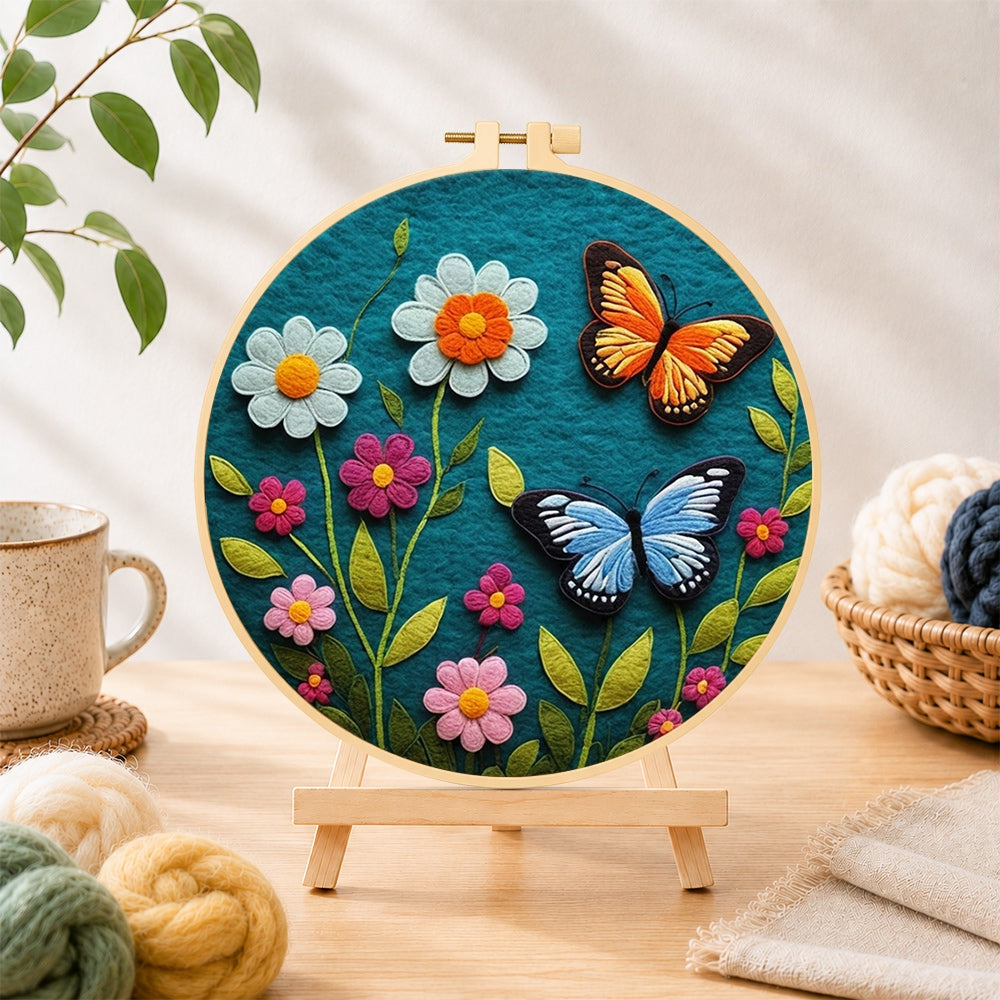 Finished charming butterfly and daisy needle felting displayed on a wooden easel