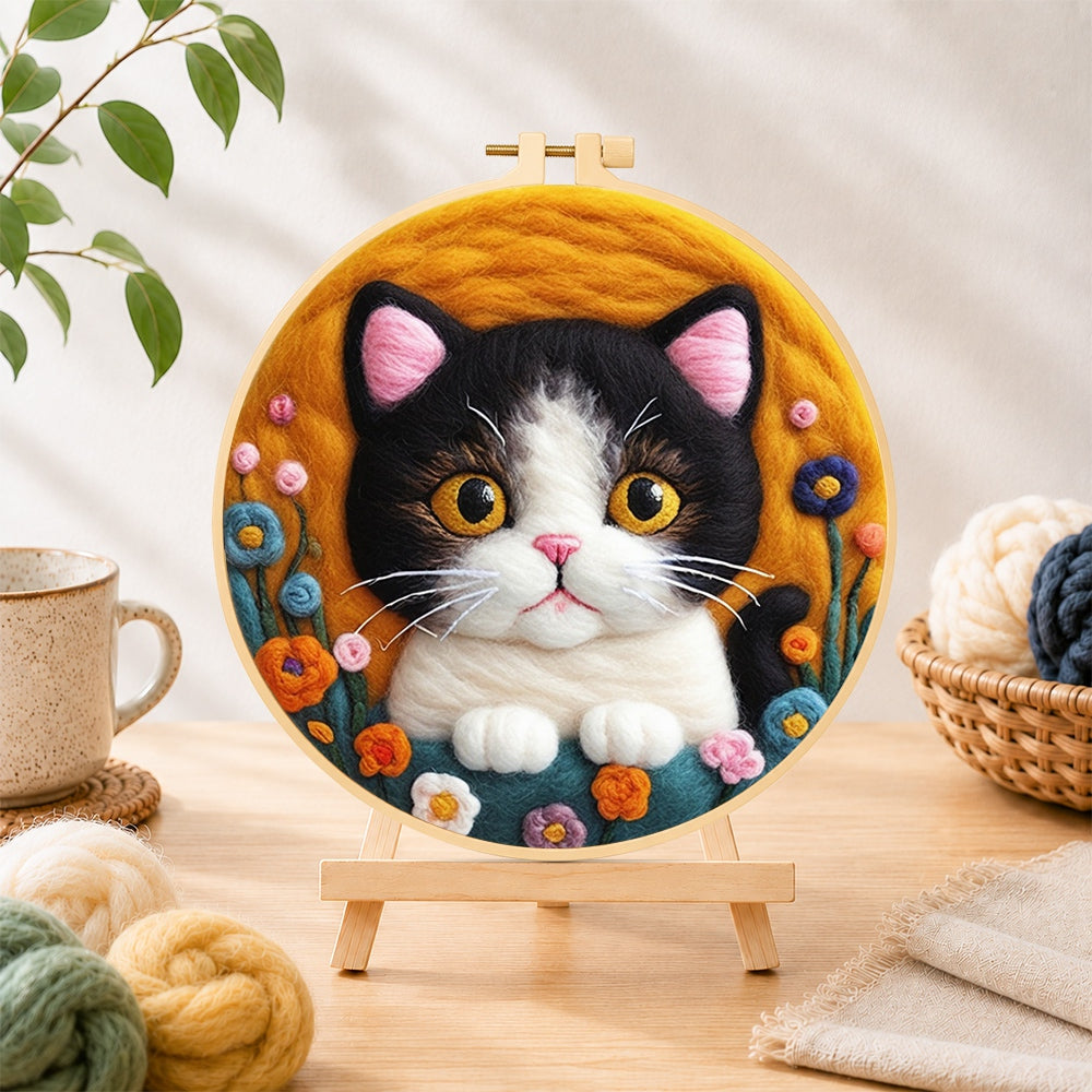Finished charming cat and cute flowers needle felting displayed on a wooden easel