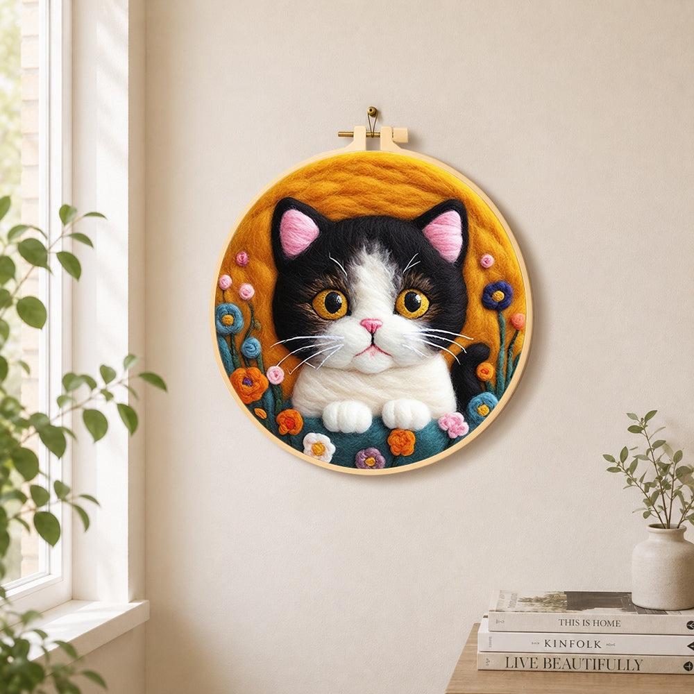 Charming cat and cute flowers needle felt wall art displayed in a bright home interior