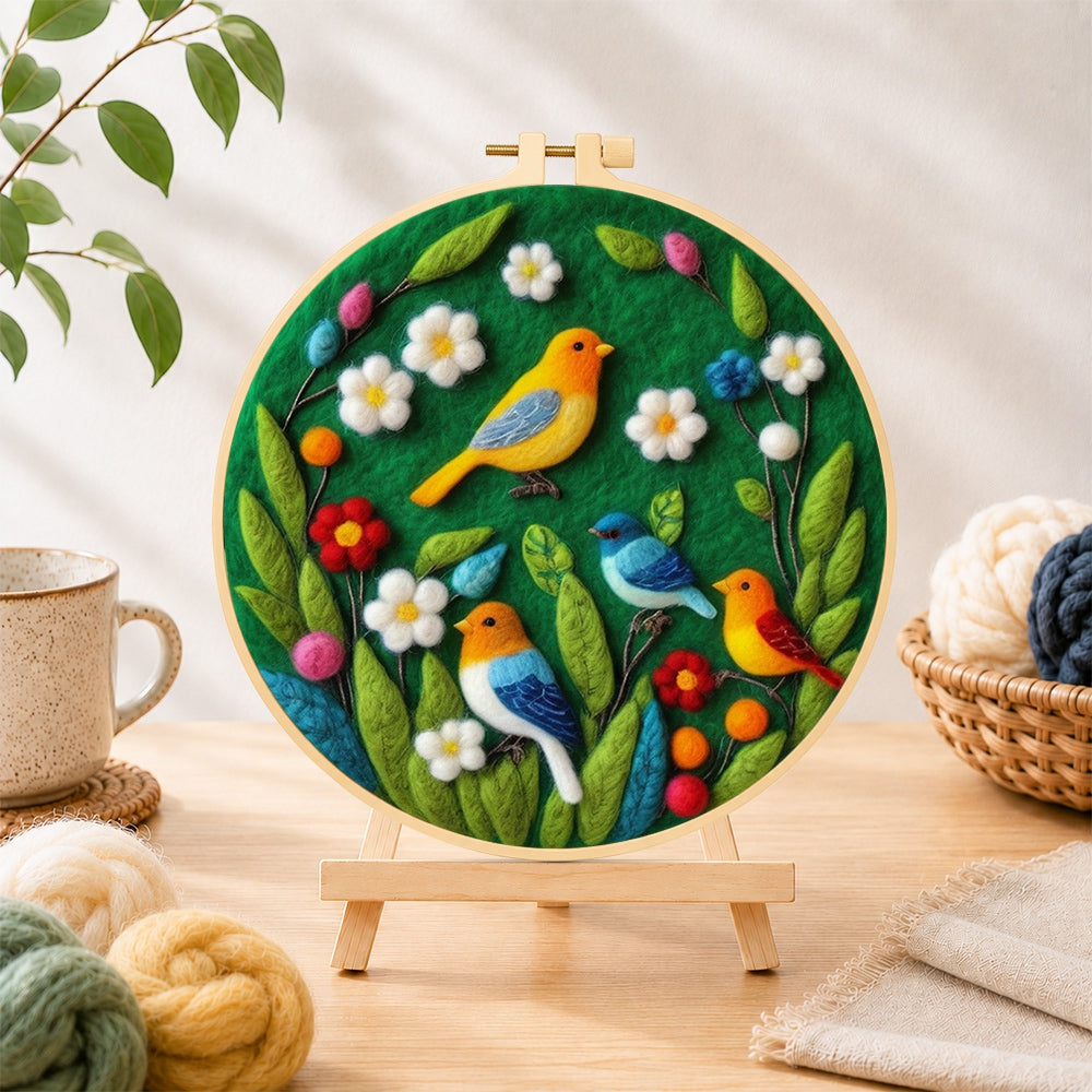 Finished charming flock of colourful birds needle felting displayed on a wooden easel