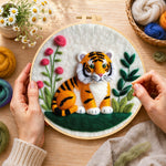 Creating the charming little tiger wool painting by hand with a felting needle