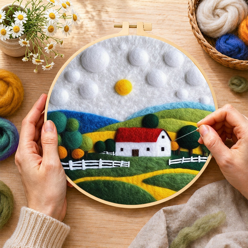 Creating the charming red roof cottage wool painting by hand with a felting needle