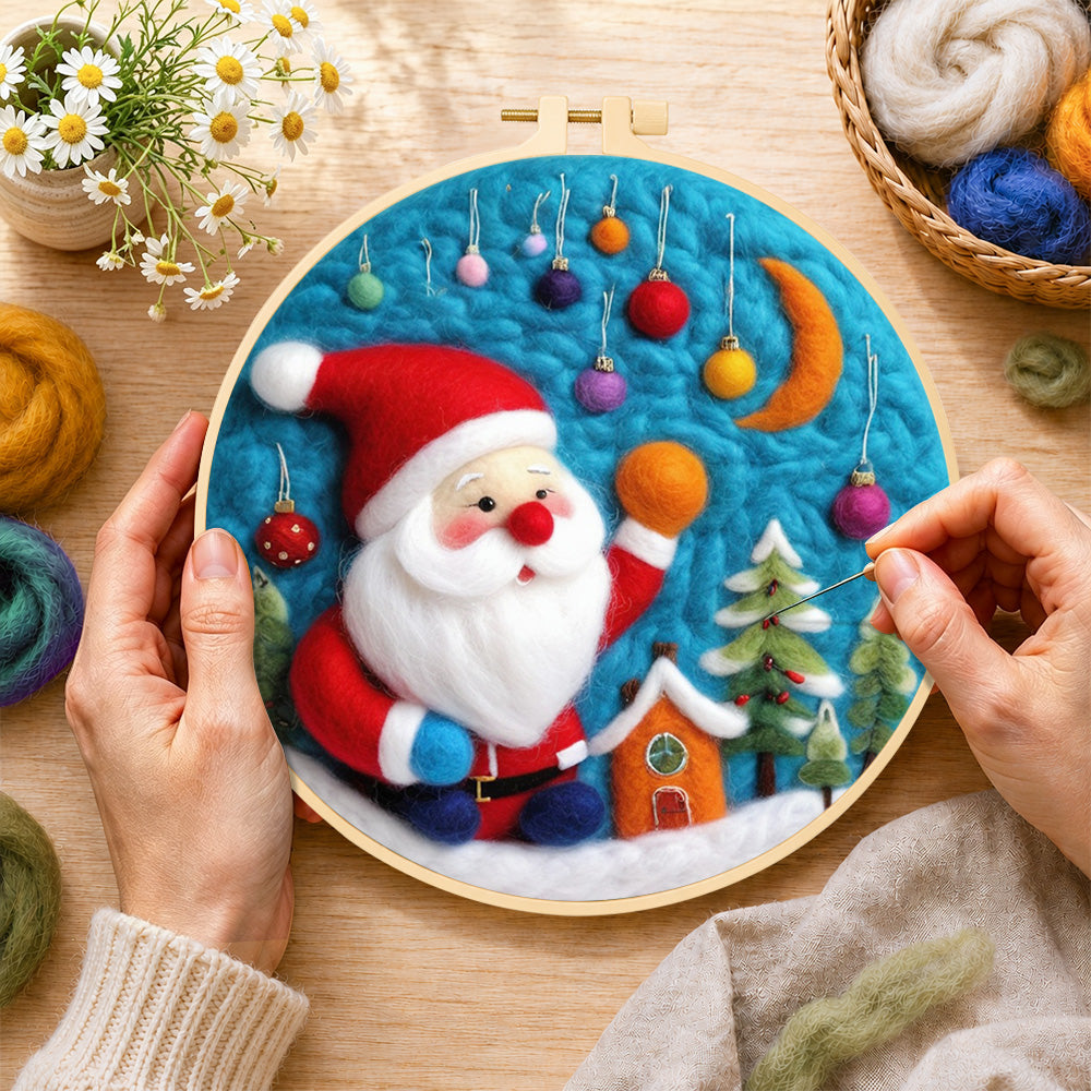 Creating the charming santa with hanging baubles wool painting by hand with a felting needle