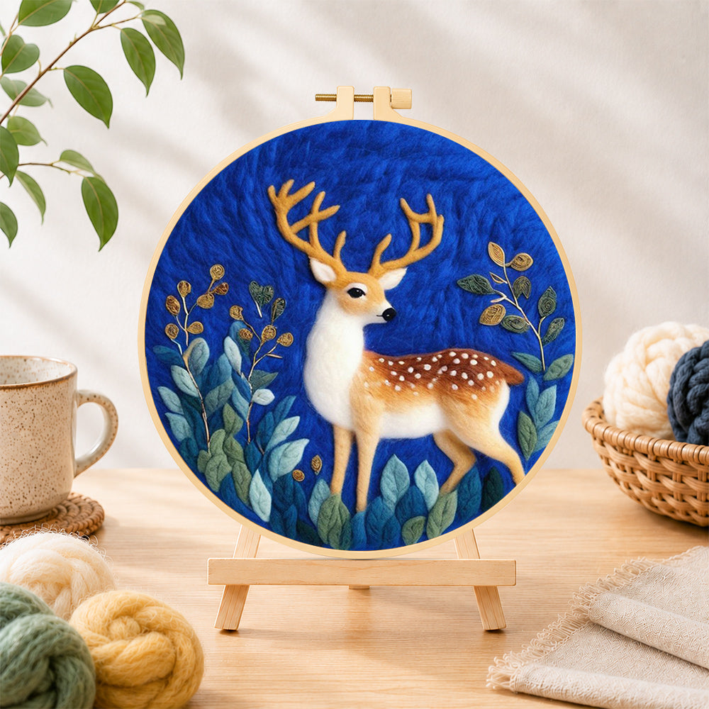Finished charming spotted fawn needle felting displayed on a wooden easel