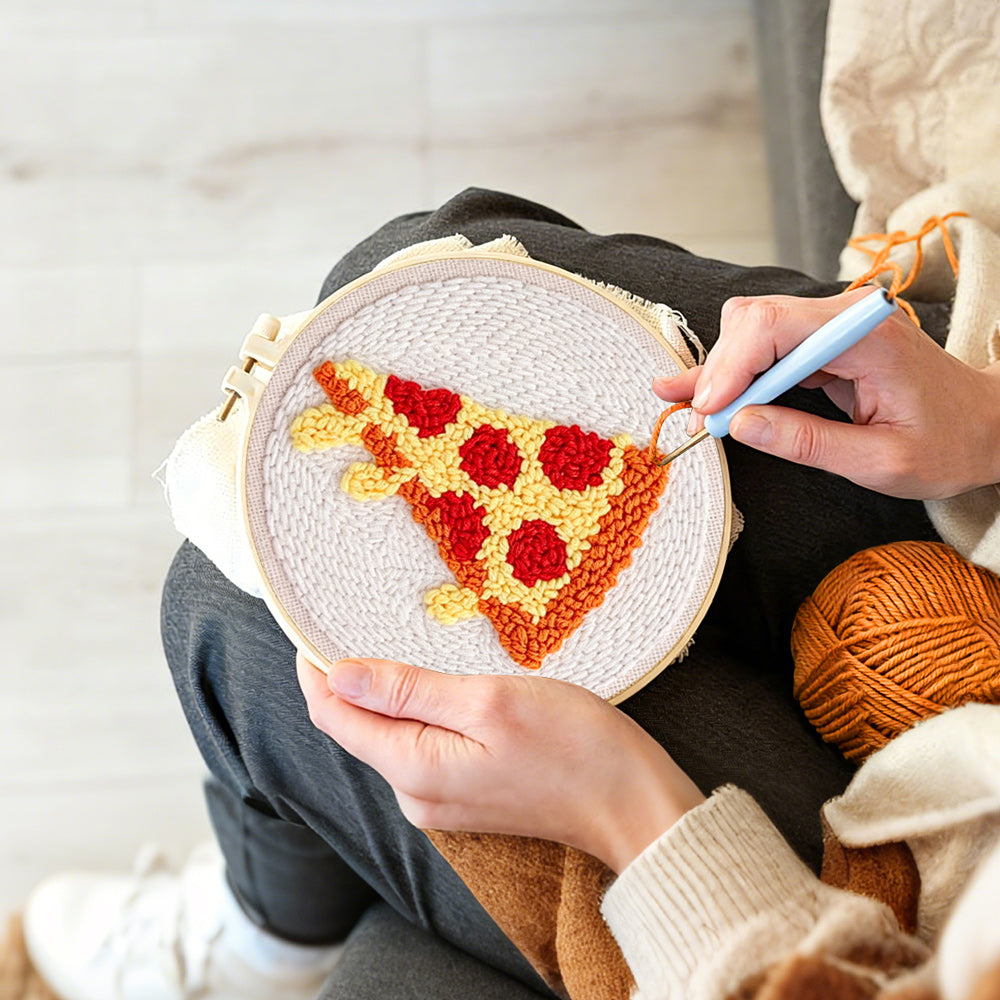 Creating handmade cheesy pizza slice punch needle artwork