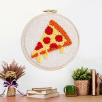 Finished cheesy pizza slice artwork displayed on a wall