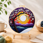 Finished cherry tree at sunset needle felting displayed on a wooden easel