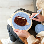 Creating handmade chocolate ice cream punch needle artwork